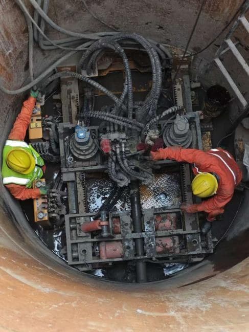 Pipe-bursting replacement equipment operating inside the work shaft.
