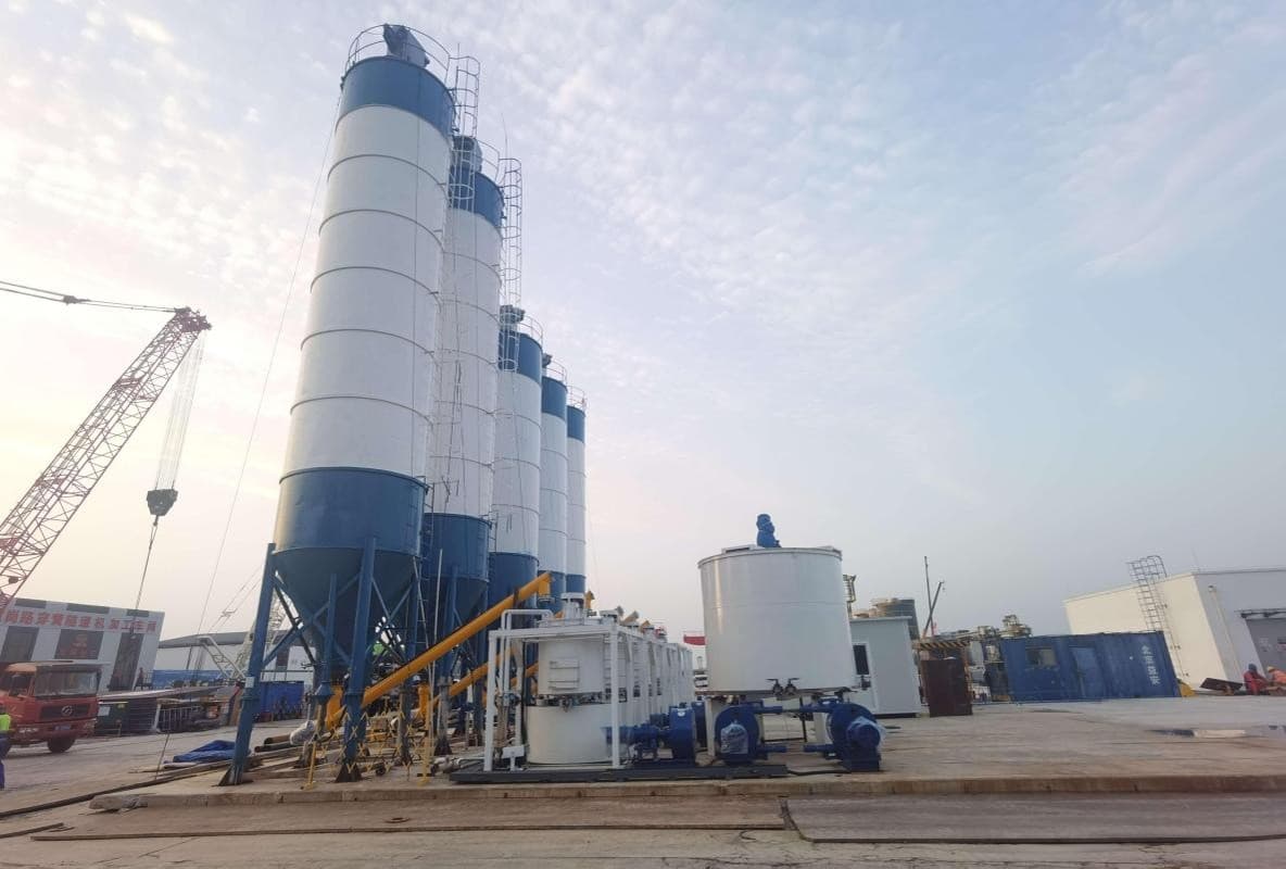 Ground mixing station with grout transport vehicles